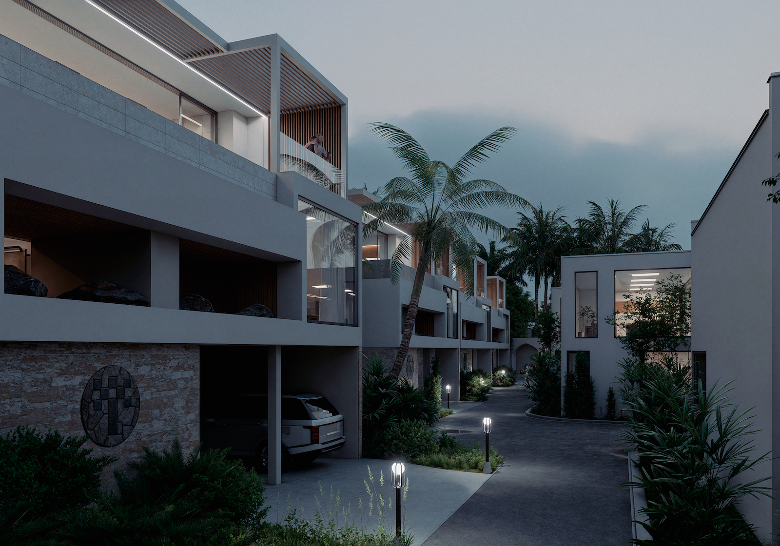 IO Villas — street-level view of villa row with garages